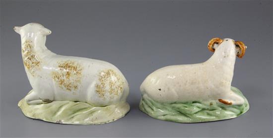 A Staffordshire creamware figure of a recumbent ram and a similar ewe